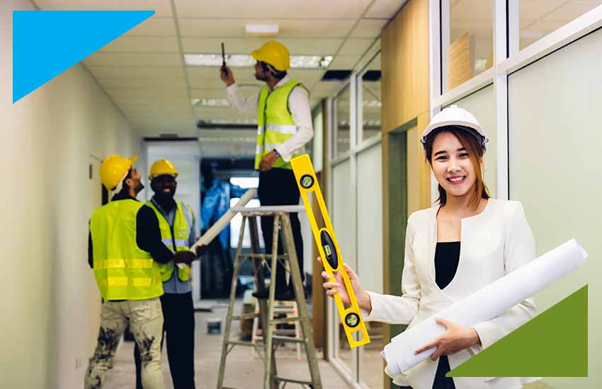 Construction and facility management professionals collaborating on-site, representing direct hire staffing for commercial services.